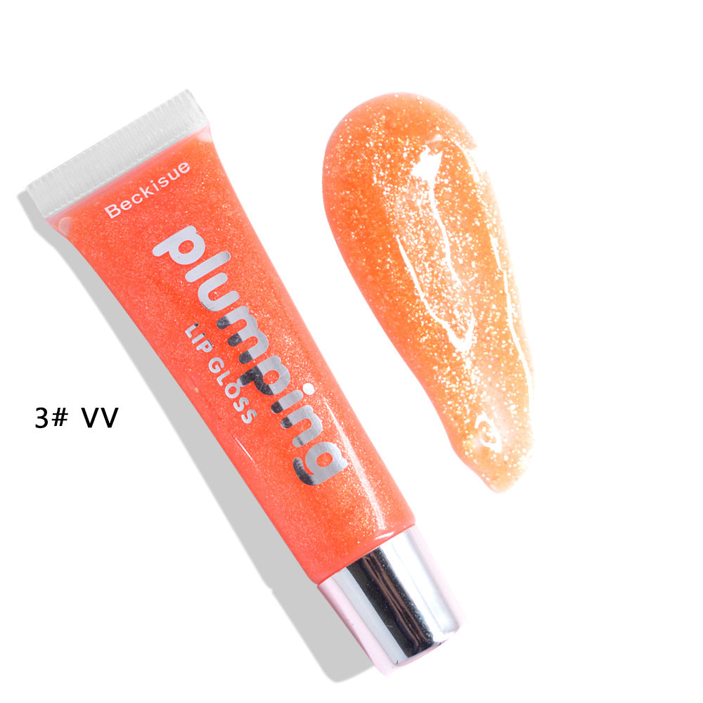 Brillo de labios húmedo con efecto volumen de cereza.