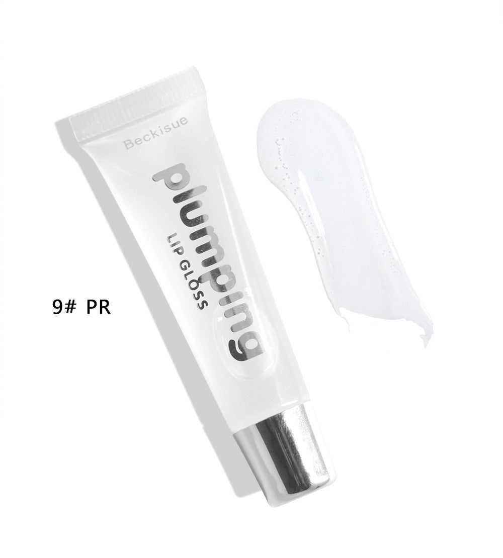 Brillo de labios húmedo con efecto volumen de cereza.