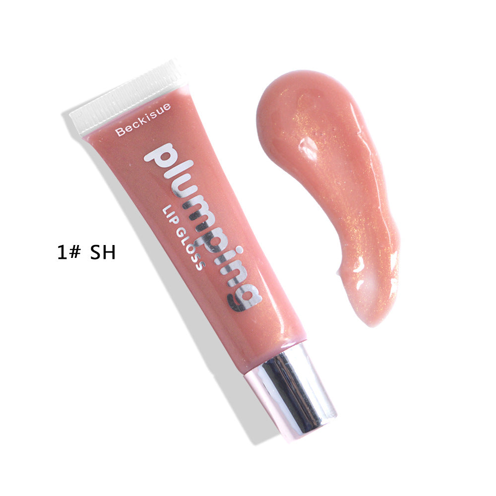 Brillo de labios húmedo con efecto volumen de cereza.