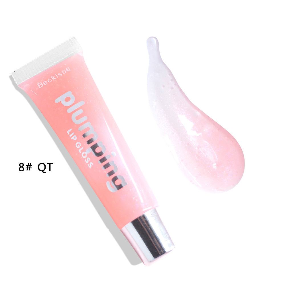 Brillo de labios húmedo con efecto volumen de cereza.