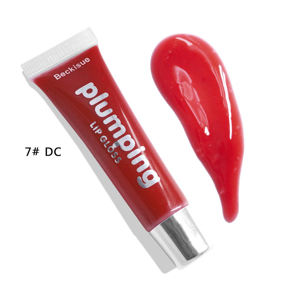 Brillo de labios húmedo con efecto volumen de cereza.
